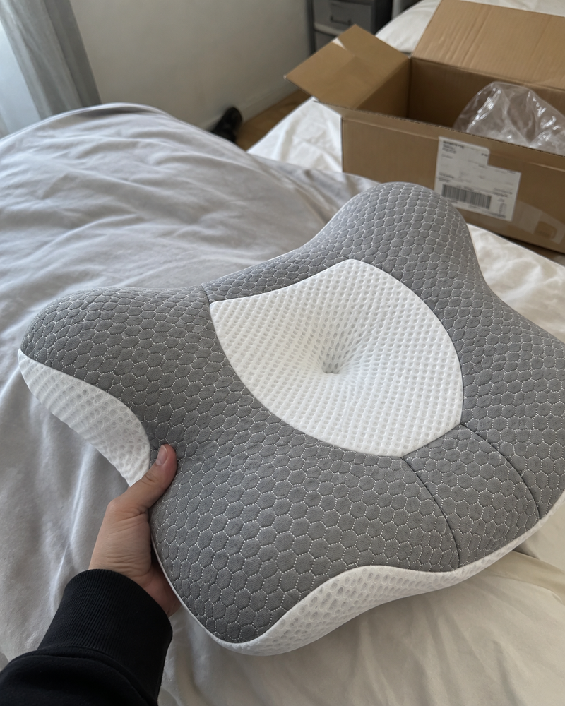 Customer unboxing the cervical pillow